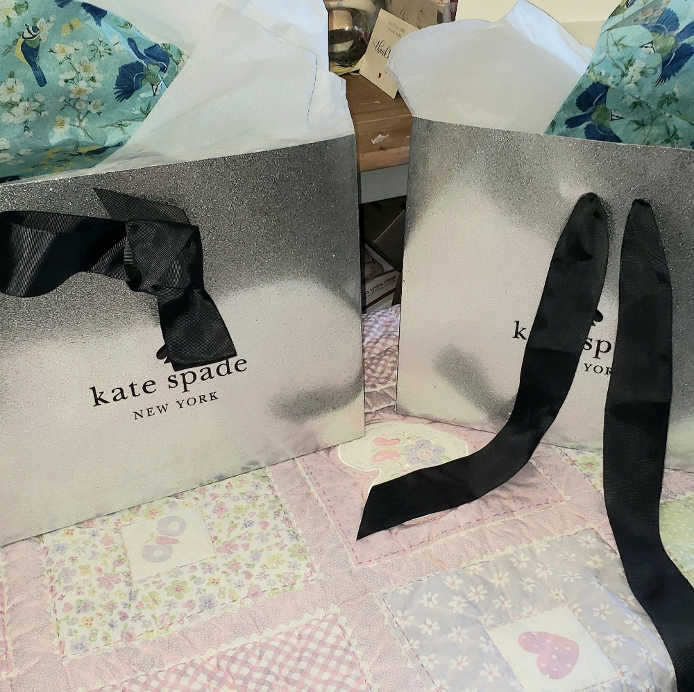 Kate Spade New York Silver Gift Bags with Black Ribbon.